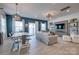 Bright living room with hardwood floors, natural light, stylish furniture, and a dining area at 11120 Pagebrook Ln, Charlotte, NC 28214