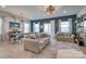 Spacious living room with dual sofas, dark accent wall, bright natural light, and stylish decorations at 11120 Pagebrook Ln, Charlotte, NC 28214
