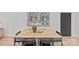 Dining room with a modern table, chairs, decor, and hardwood floors at 1300 Queens Rd # 408, Charlotte, NC 28207