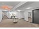 Hallway view showcasing patterned carpet, modern lighting, and tasteful decor with a convenient exit sign at 1300 Queens Rd # 408, Charlotte, NC 28207