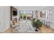 Bright living room featuring modern fireplace, hardwood floors and sliding glass doors to balcony at 1300 Queens Rd # 408, Charlotte, NC 28207