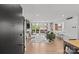 Spacious living room with hardwood floors, balcony access, and an open-concept design at 1300 Queens Rd # 408, Charlotte, NC 28207