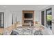 Cozy living room featuring a fireplace, hardwood floors, and lots of natural light at 1300 Queens Rd # 408, Charlotte, NC 28207