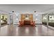 An inviting lobby featuring a patterned floor, wood accent wall, stylish seating, and an abundance of natural light at 1300 Queens Rd # 408, Charlotte, NC 28207