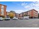 Well-kept parking lot view of the condo building exterior on a clear day at 1300 Queens Rd # 408, Charlotte, NC 28207
