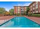 A refreshing outdoor pool with lounge chairs offering a relaxing and resort-like amenity at 1300 Queens Rd # 408, Charlotte, NC 28207