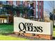 Beautifully landscaped grounds with prominent building signage at 1300 Queens Rd # 408, Charlotte, NC 28207
