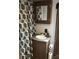 Cozy bathroom featuring a vanity sink, mirror, and decorative shower curtain for a complete look at 137 Landlubber Trl, Mount Gilead, NC 27306