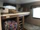 This is a bunk room with overhead storage and individual reading lights at 137 Landlubber Trl, Mount Gilead, NC 27306