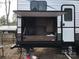 Exterior of an RV with pull-out kitchen area and ample storage at 137 Landlubber Trl, Mount Gilead, NC 27306