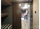 Hallway with a closed sliding wood door to the bunk room at 137 Landlubber Trl, Mount Gilead, NC 27306