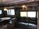 A look at the RV living room with leather couch and dinette at 137 Landlubber Trl, Mount Gilead, NC 27306