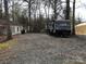RV with gravel space and a small yard perfect for camping at 137 Landlubber Trl, Mount Gilead, NC 27306