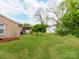 This backyard is spacious and well maintained with mature trees at 1401 Birch St, Kannapolis, NC 28081