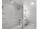 Bright bathroom featuring a tub/shower combo and a vanity with storage at 1401 Birch St, Kannapolis, NC 28081