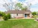 Charming single-story brick home with a bright blue front door and a well-manicured lawn at 1401 Birch St, Kannapolis, NC 28081
