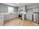 Modern kitchen with stainless steel appliances, granite countertops, and ample cabinet space at 1401 Birch St, Kannapolis, NC 28081