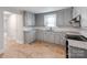 Well-lit kitchen featuring granite countertops, stylish cabinets, and modern appliances at 1401 Birch St, Kannapolis, NC 28081