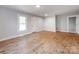 Bright, newly renovated living room with wood-look flooring and freshly painted walls at 1401 Birch St, Kannapolis, NC 28081