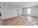 Bright, freshly painted living room featuring wood-look flooring and natural light at 1401 Birch St, Kannapolis, NC 28081