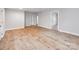 Expansive living room showcasing freshly painted neutral walls and attractive wood-look flooring at 1401 Birch St, Kannapolis, NC 28081