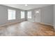 Inviting living room with wood floors, lots of natural light, and a white front door at 1401 Birch St, Kannapolis, NC 28081