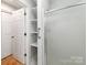 This bathroom features a walk in shower, a large closet, and a door to the hallway at 1401 Birch St, Kannapolis, NC 28081