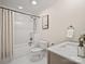 Bathroom featuring a shower over the bathtub, a single sink and a modern toilet at 1511 Churchill Downs Dr, Waxhaw, NC 28173