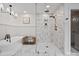 Bright bathroom features marble tile, free-standing tub, and large glass enclosed shower with bronze fixtures at 1511 Churchill Downs Dr, Waxhaw, NC 28173