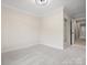 A simple empty bedroom with clean walls, carpeted floors and simple lighting at 1511 Churchill Downs Dr, Waxhaw, NC 28173