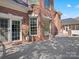 Brick home exterior with white trim, a large deck, and sliding glass doors at 1511 Churchill Downs Dr, Waxhaw, NC 28173