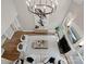 Stunning living room boasts high ceilings, a fireplace, and an elegant chandelier, creating a grand and inviting atmosphere at 1511 Churchill Downs Dr, Waxhaw, NC 28173