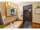 Bathroom with a vanity, decorative mirror, and a glimpse into a hallway with built-in storage at 167 Holly Harbor Trl # 169/170, Mount Gilead, NC 27306