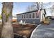 Charming gray house with a cozy front yard featuring white Adirondack chairs and a flag at 167 Holly Harbor Trl # 169/170, Mount Gilead, NC 27306