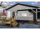 Exterior with a wooden deck and a grey home at 167 Holly Harbor Trl # 169/170, Mount Gilead, NC 27306