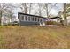 Home's exterior with well-maintained yard and seating area at 167 Holly Harbor Trl # 169/170, Mount Gilead, NC 27306
