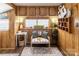 Cozy living room featuring wood-paneled walls, built-in cabinets, and a comfortable seating area at 167 Holly Harbor Trl # 169/170, Mount Gilead, NC 27306