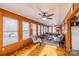 Bright sunroom with wood floors and paneled walls, with plenty of natural light from many windows at 167 Holly Harbor Trl # 169/170, Mount Gilead, NC 27306