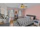 Charming bedroom with a playful ambiance, featuring soft pink walls, modern decor, and a cozy bed at 2016 Monaghan Ct, Matthews, NC 28105