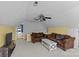 Bonus room featuring brown seating, television, neutral carpet and a bright window at 2016 Monaghan Ct, Matthews, NC 28105