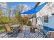Inviting deck with dining area, shaded seating, and stylish outdoor accents at 2016 Monaghan Ct, Matthews, NC 28105