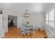 Cozy dining area with modern lighting and decor, seamlessly connecting to an adjacent room, exuding comfort at 2016 Monaghan Ct, Matthews, NC 28105