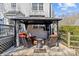 Backyard gazebo featuring comfortable seating and television is great for outdoor entertaining at 2016 Monaghan Ct, Matthews, NC 28105