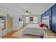 Large bedroom features hardwood floors and a king-size bed at 2016 Monaghan Ct, Matthews, NC 28105
