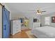 Spacious bedroom featuring a blue barn door and walk-in closet at 2016 Monaghan Ct, Matthews, NC 28105