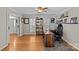 Well-lit office showcasing hardwood floors, ample windows, and a comfortable workspace, enhancing productivity at 2016 Monaghan Ct, Matthews, NC 28105