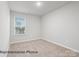 Neutral bedroom featuring a window that provides lots of natural light and carpeted floors at 2019 Mcdonald Dr, Charlotte, NC 28216