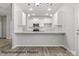 Bright kitchen features white cabinetry, granite counters, and stainless steel appliances at 2019 Mcdonald Dr, Charlotte, NC 28216