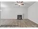 Spacious living room with a traditional fireplace and stylish flooring at 2019 Mcdonald Dr, Charlotte, NC 28216