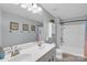 Well-lit bathroom features a double sink vanity, framed artwork, and shower-tub combo enhancing comfort and convenience at 2019 Taylorcrest Dr, Fort Mill, SC 29715